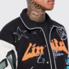 black boxy fit graffiti varsity jacket patched
