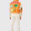 yellow boxy fit graffiti varsity jacket back side