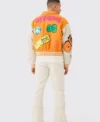 yellow boxy fit graffiti varsity jacket back side