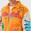 yellow boxy fit graffiti varsity jacket patched