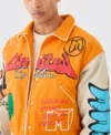 yellow boxy fit graffiti varsity jacket patched