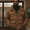 Elsbeth S02 Joshua Echebiri Brown Puffer Jacket Side