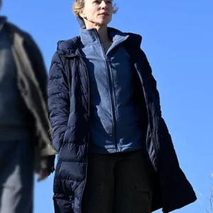 The Travellers 2025 Susie Porter Blue Puffer Coat front