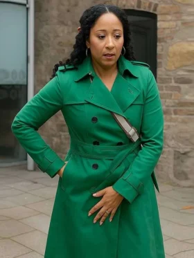 Haunted Harmony Mysteries Buried at C Tamera Mowry-Housley Green Coat Side