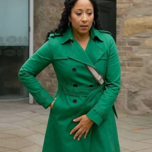 Haunted Harmony Mysteries Buried at C Tamera Mowry-Housley Green Coat Side