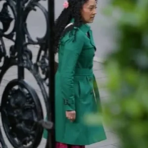 Haunted Harmony Mysteries Buried at C Tamera Mowry-Housley Green Coat Front